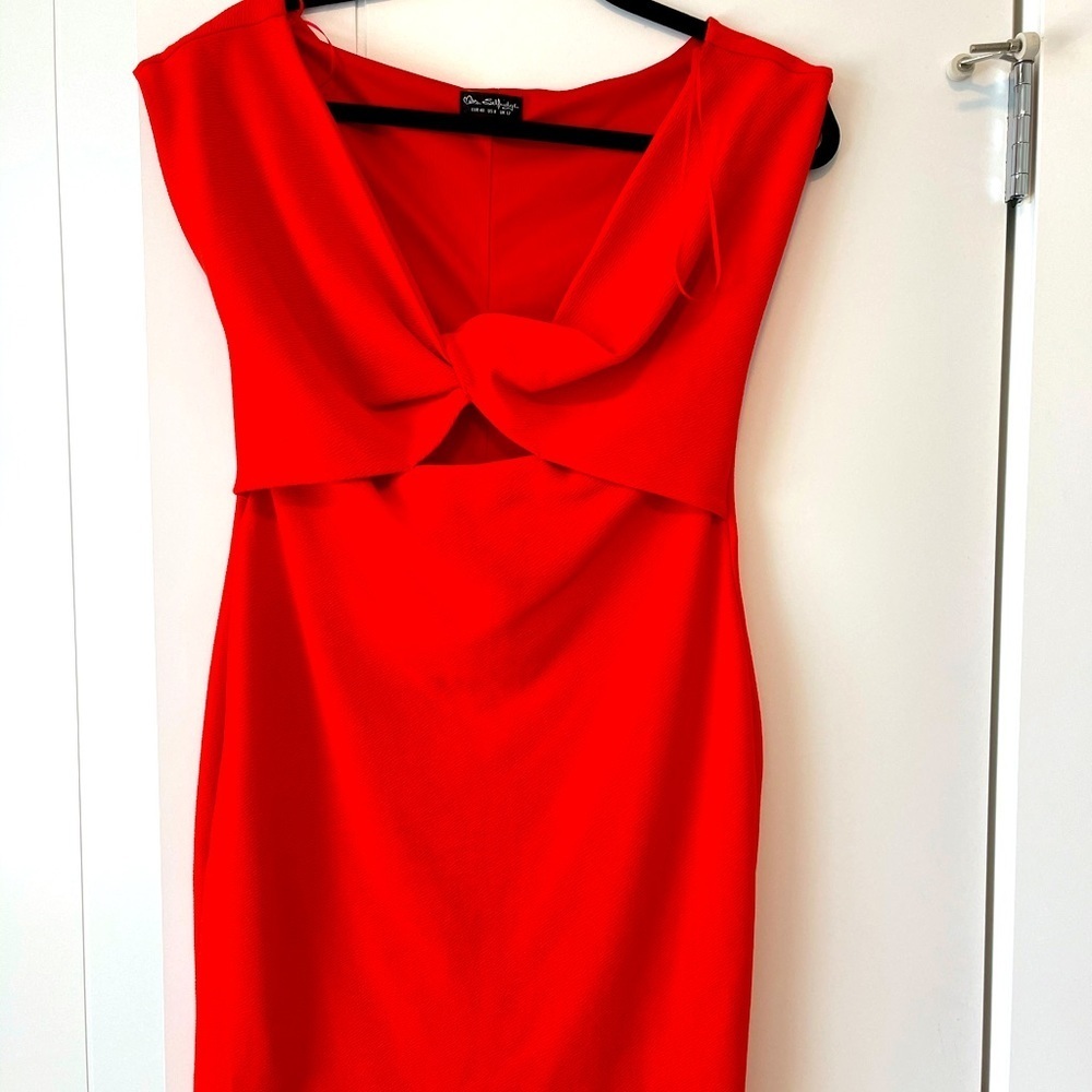 Red dress with cut out. Never worn size US 8